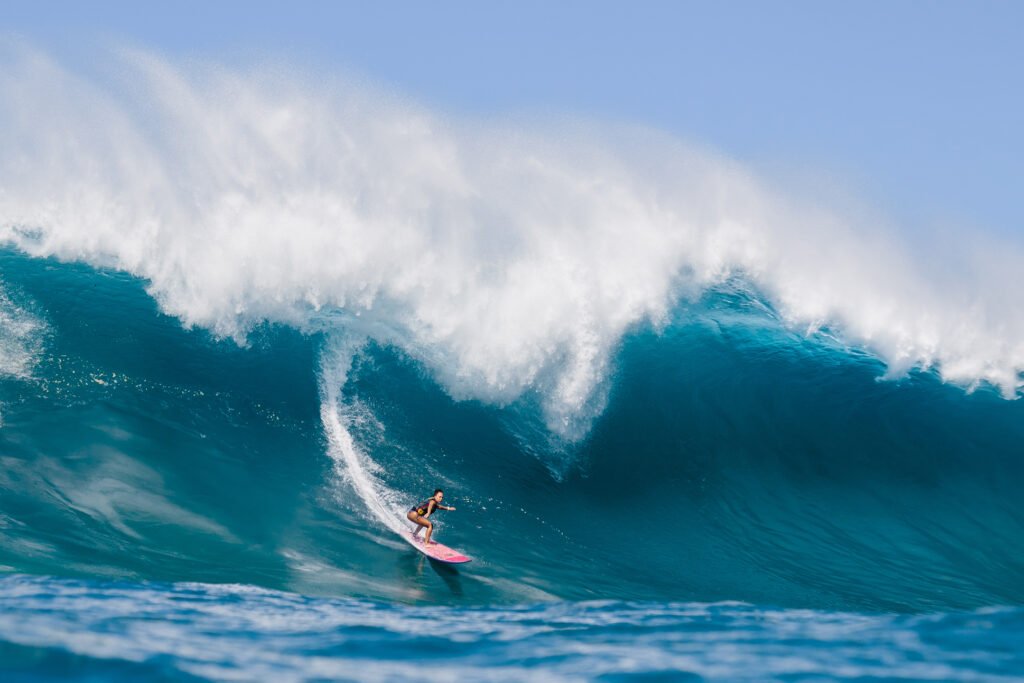 Makani Adric surfs Waimea Bay, Oahu on January 16, 2021.